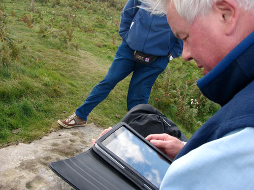 Figure 12. Participant using own iPad during Lordenshaw site visit (Rothbury, Workshop 2)