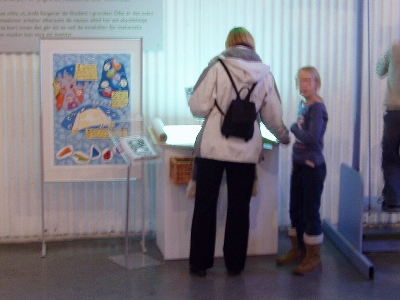 Photo: Pointing out exhibits